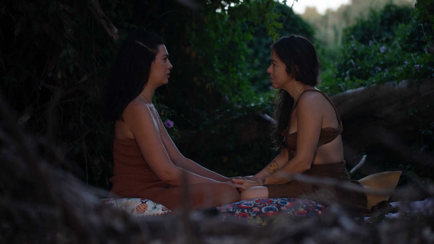 A tantra counselling conversation between two women seated outdoors